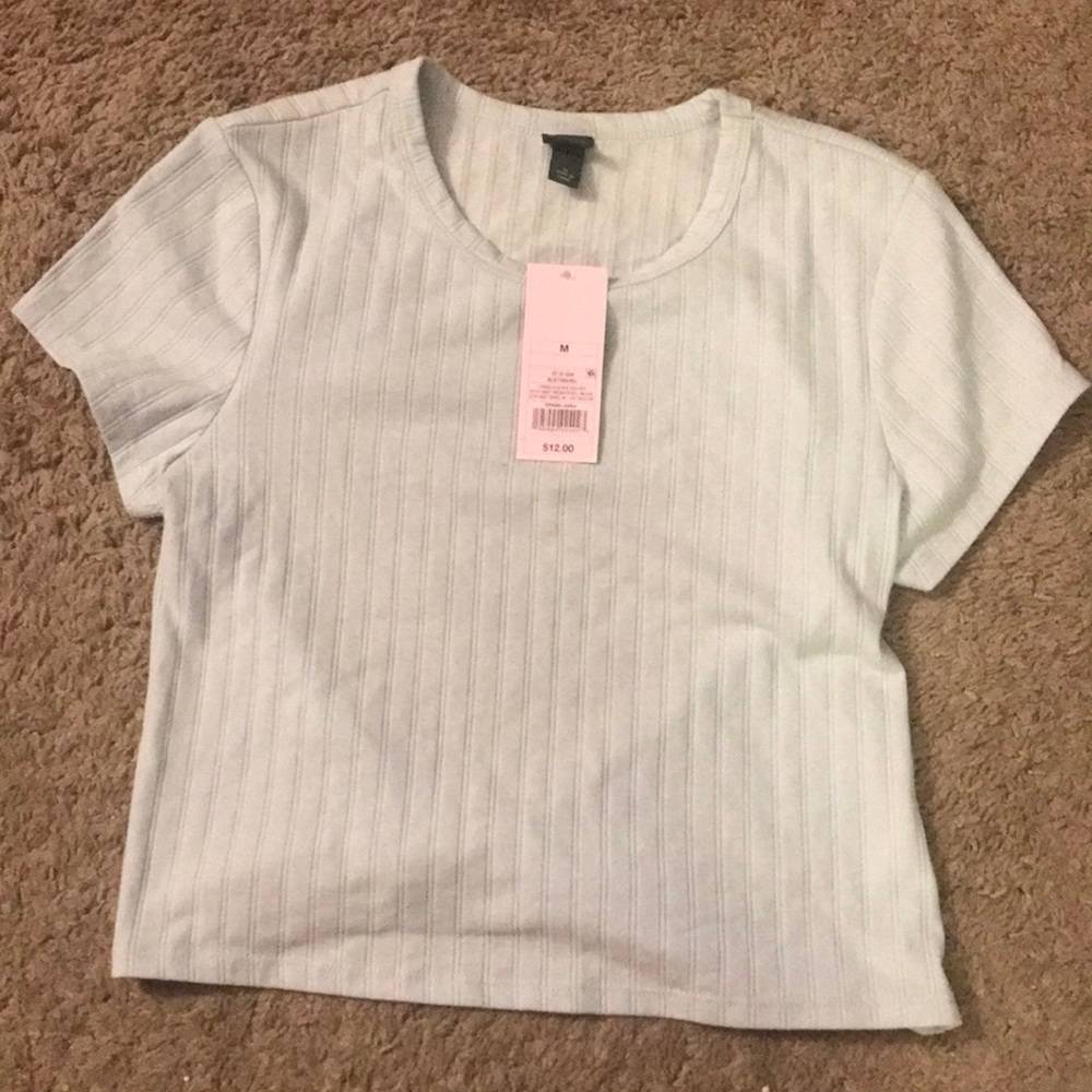 Wild fable blue top with cut out in back size medium